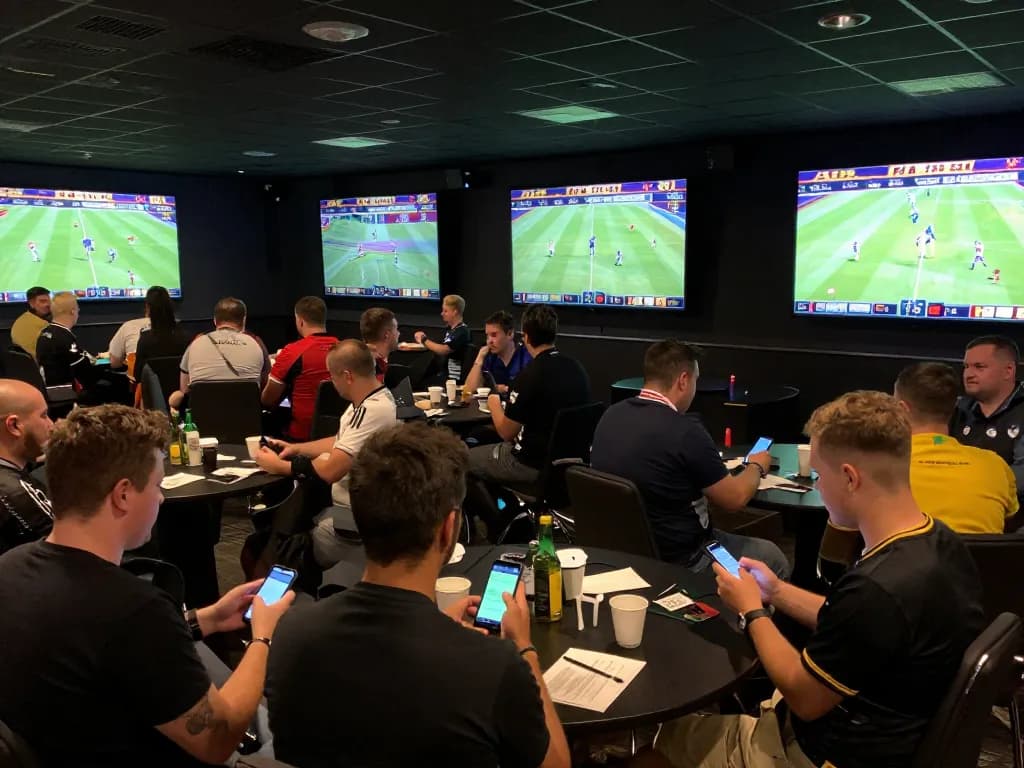 Spectators engaged in sbobet sports betting amid live event excitement